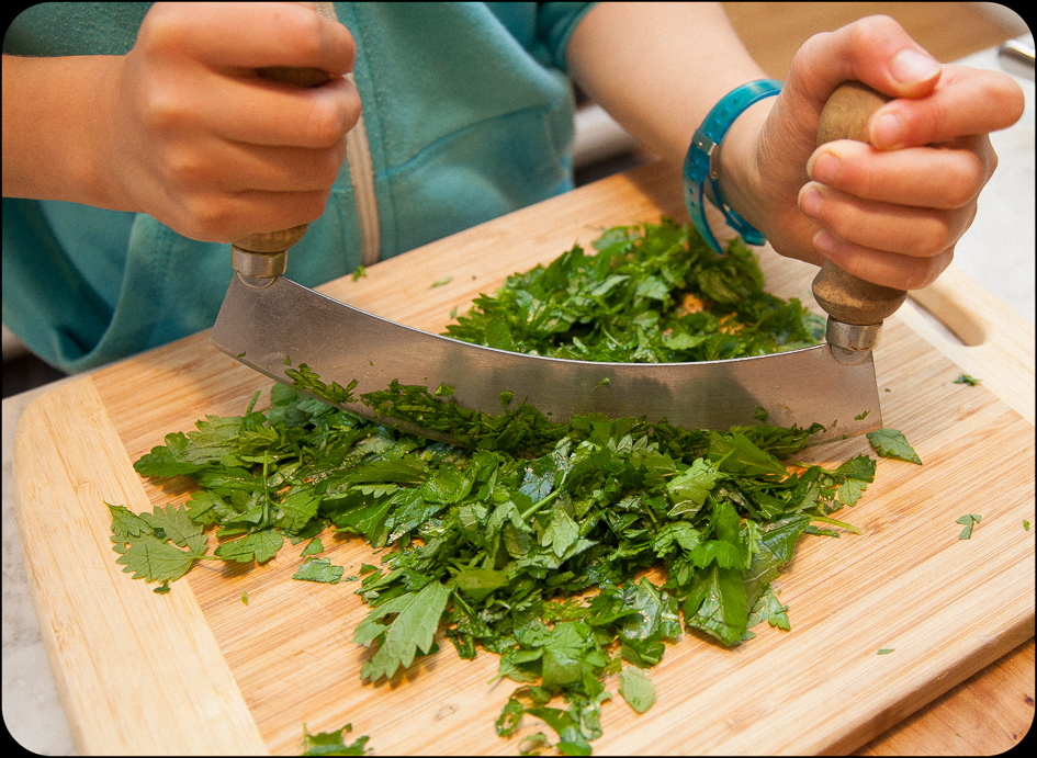 Mezza Luna knife makes cutting herbs fast. 