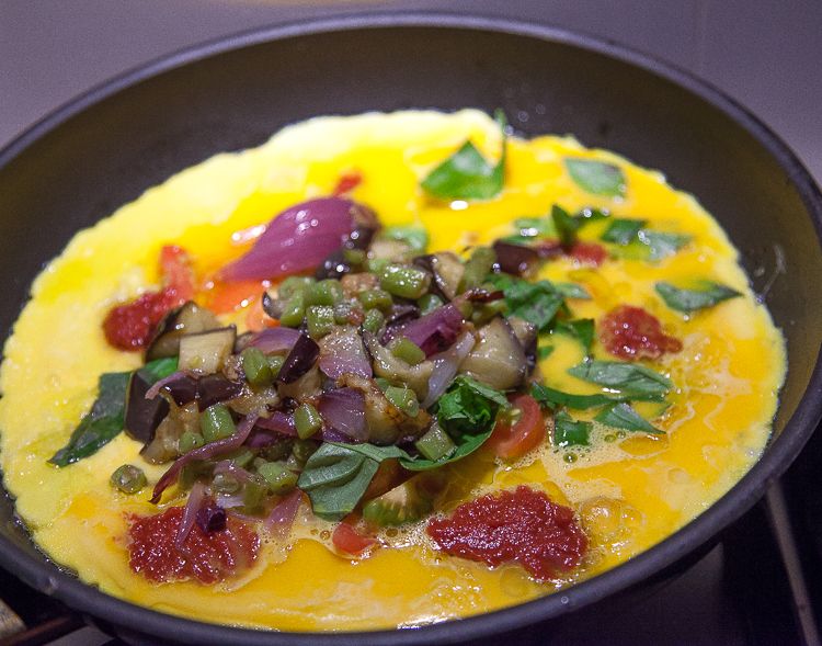 Summer meal: omelette with eggplant, french beans, red onion, basil and tomato.