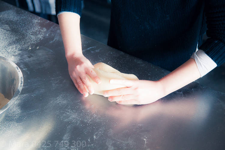 Slow press down with thumbs while dragging, rolling dough forward. 