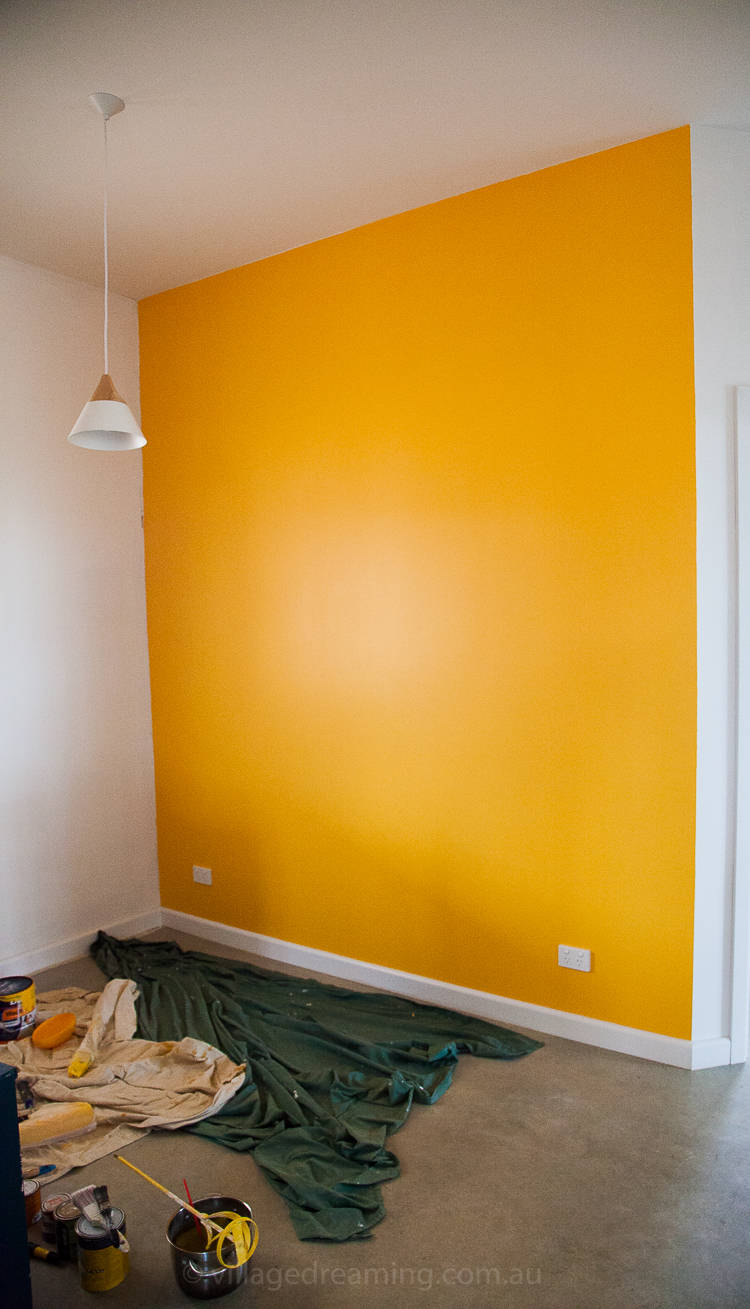 A study wall in deep yellow.