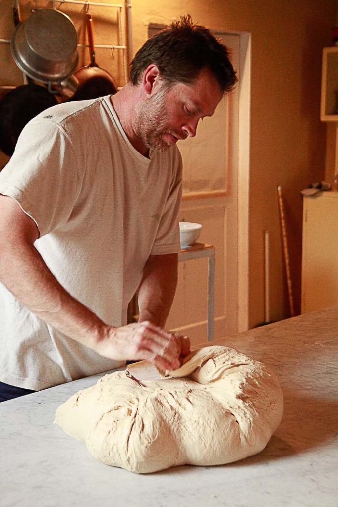 Ralf making bread on the day that master baker Ken is off to tend other responsibilities. 